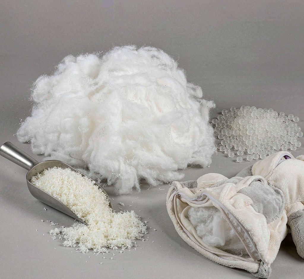Filling samples of PP cotton and fiber alternatives displayed with a sample plush