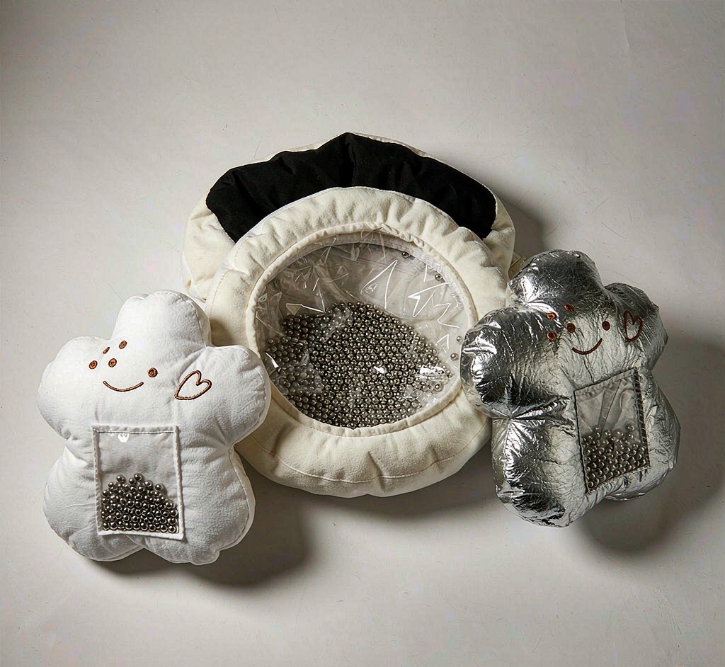 A weighted plush toy inner liner filled with beads shown next to finished pieces
