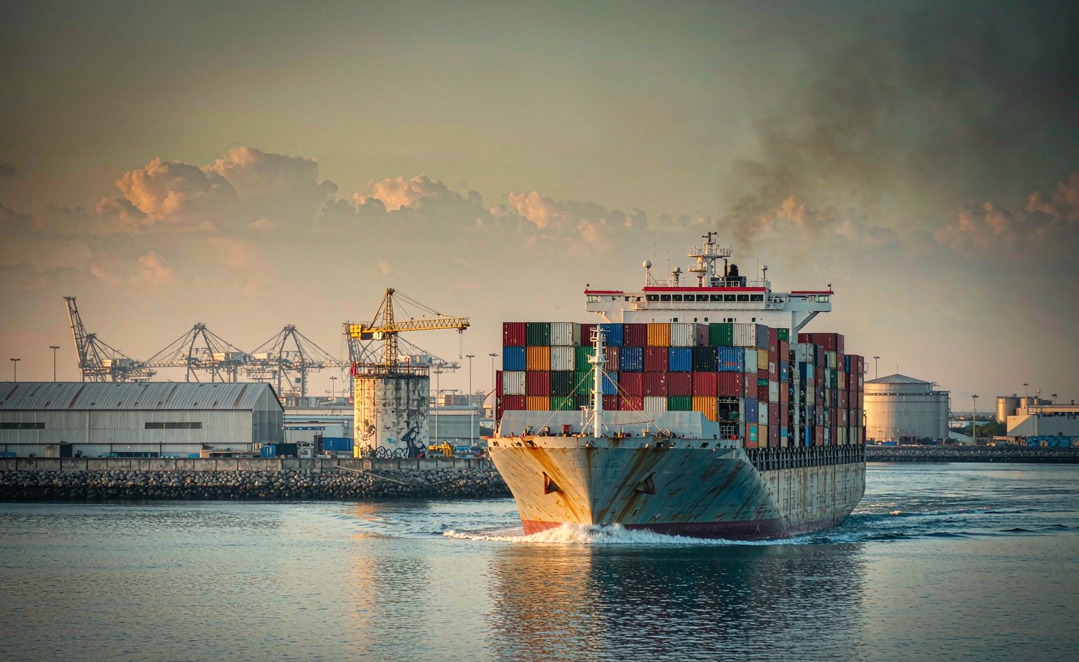 A container ship loaded with colorful shipping containers departing a Chinese port in late January, symbolizing the last pre-Chinese New Year sailing window before the holiday shutdown