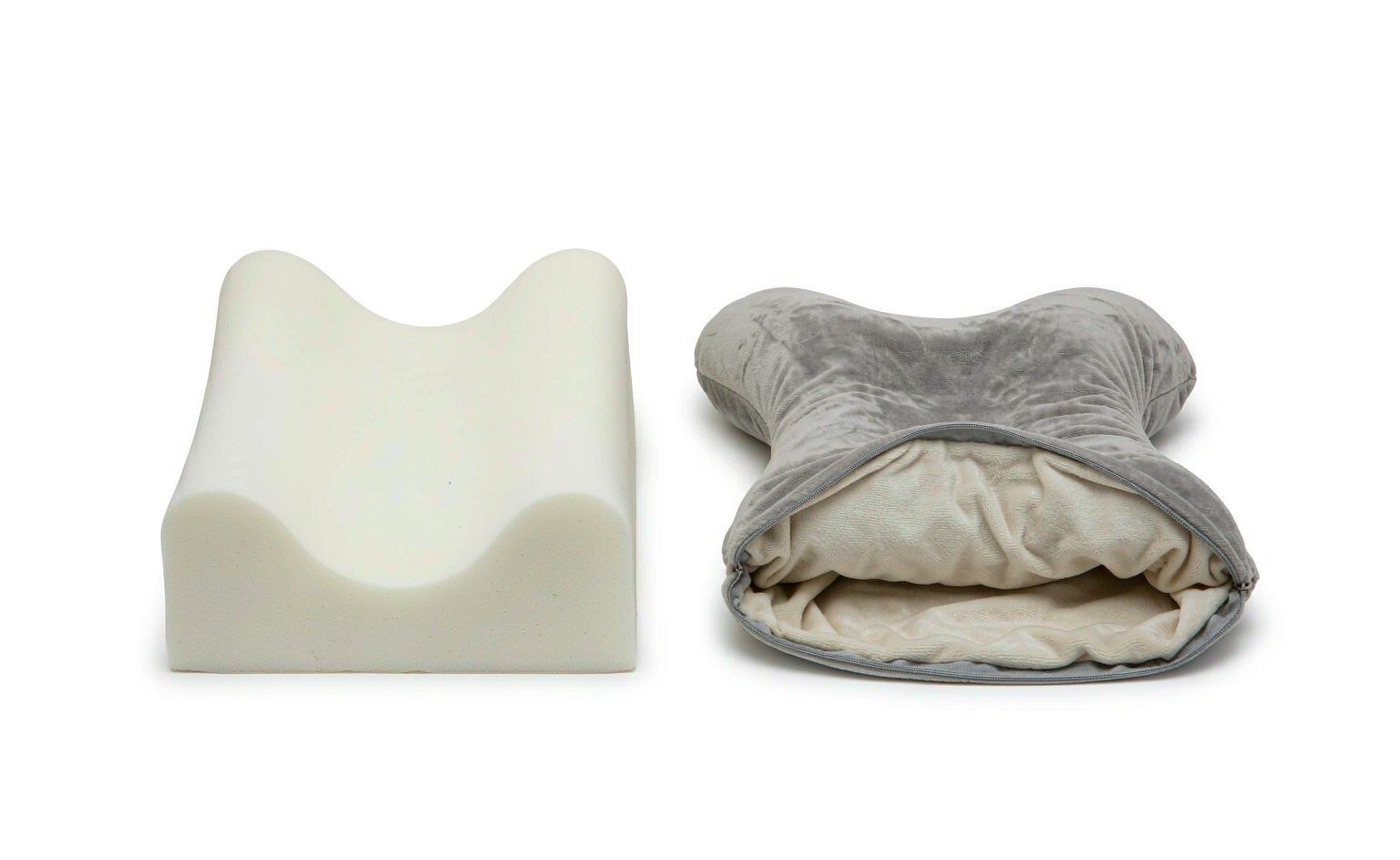 A cutaway style product photograph of a plush travel neck pillow showing the memory foam core inside the unzippered removable washable plush shell, with the two parts displayed side by side on a clean surface